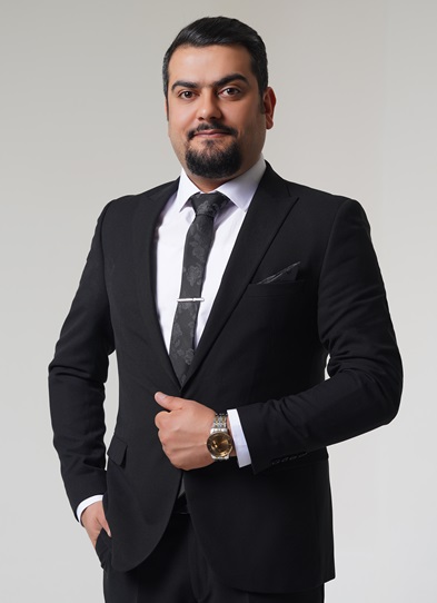Portrait of Omid Ghafarian in a dark suit